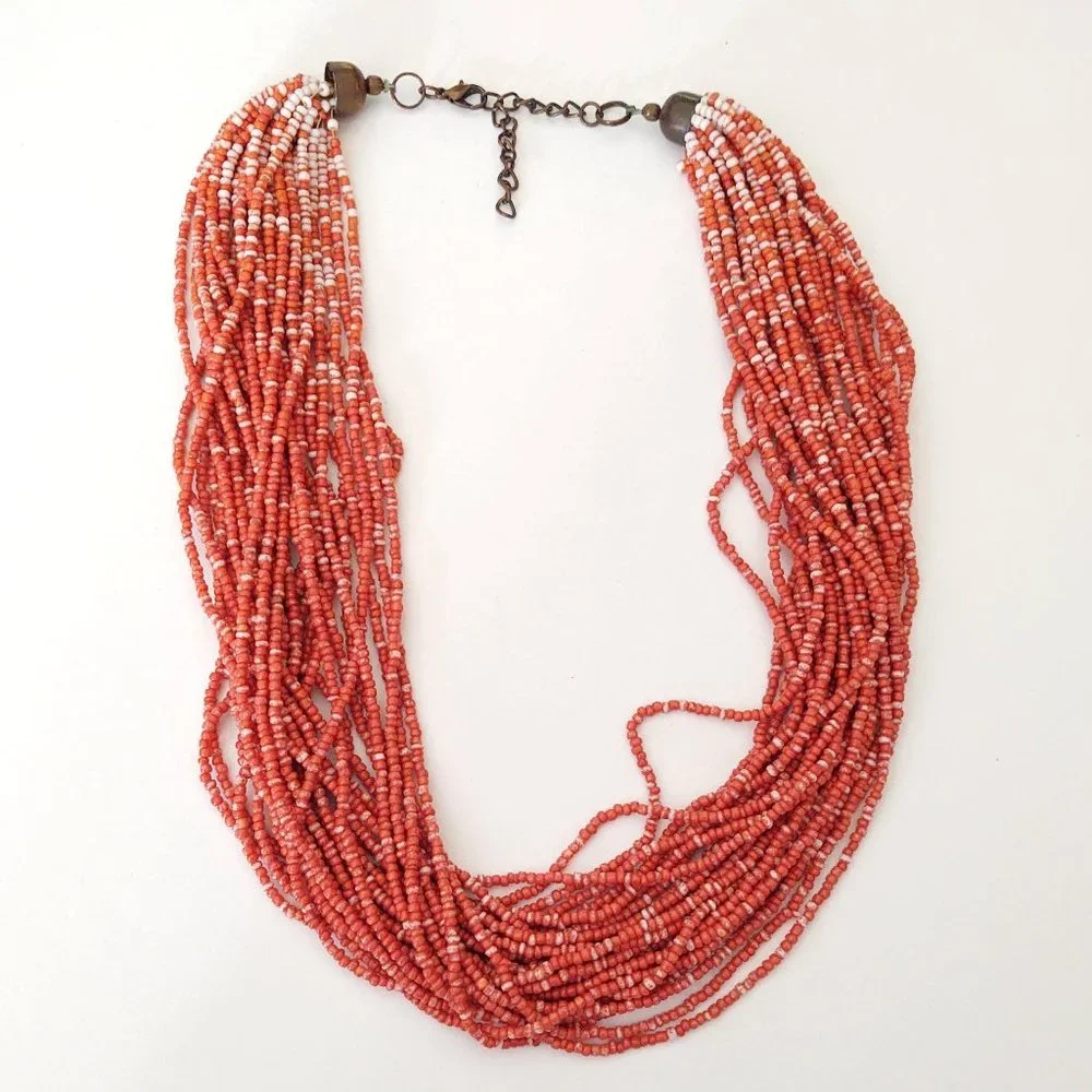 Orange and white multi strand seed bead necklace